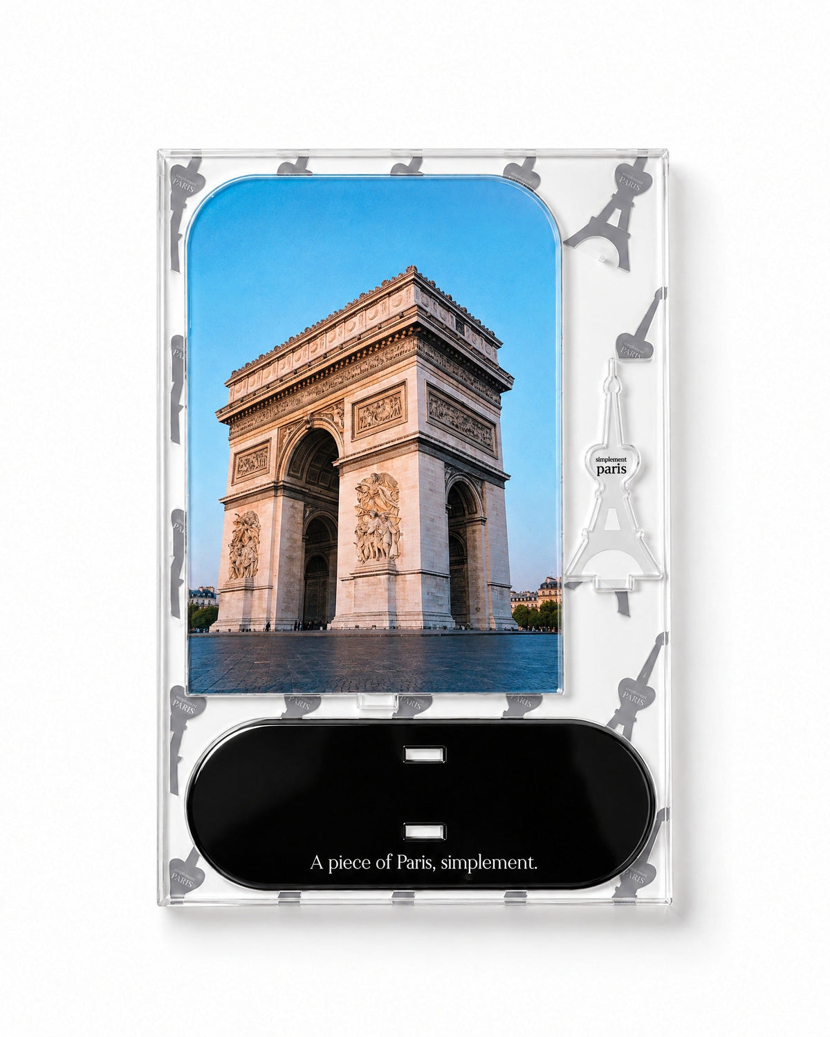 Flat-pack contents of Arc at Dusk: acrylic panel, glossy black base and Eiffel Tower piece