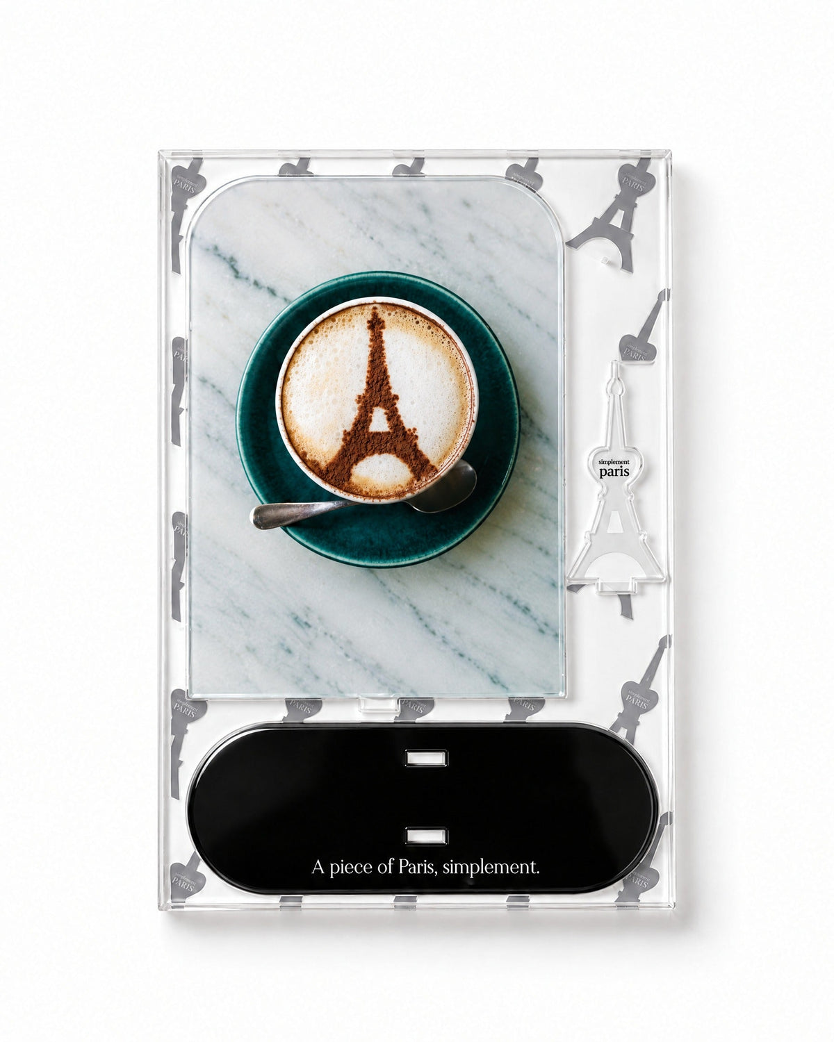 Flat-pack contents of Café Eiffel: acrylic panel, glossy black base and Eiffel Tower piece