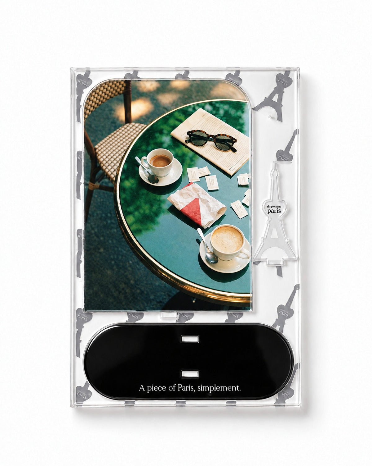 Flat-pack contents of Café Morning: printed acrylic panel, glossy black base and Eiffel Tower piece