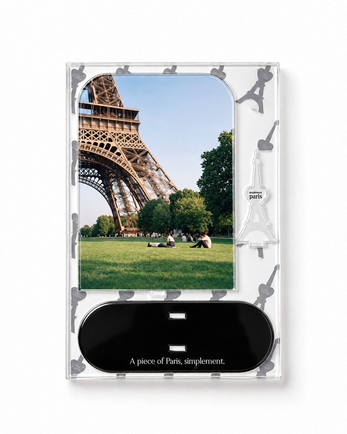 Flat-pack contents of Champ de Mars: acrylic panel, glossy black base and Eiffel Tower piece