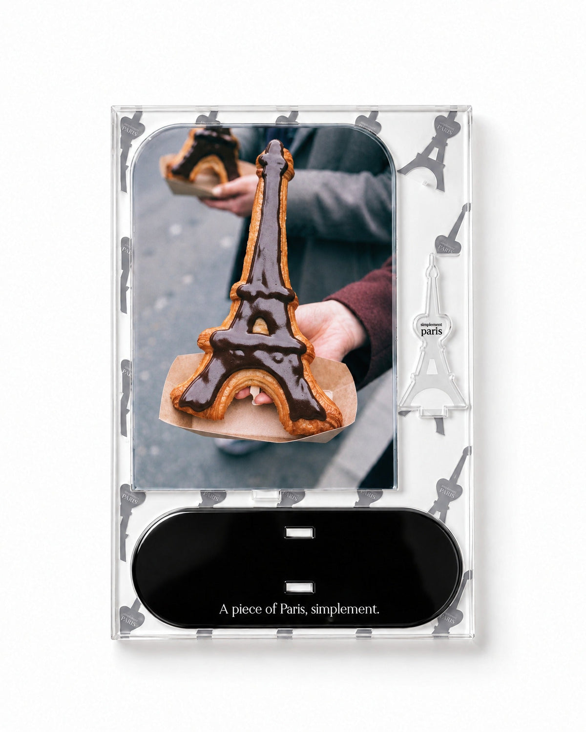Flat-pack contents of Eiffel Croissant: printed acrylic panel, glossy black base and Eiffel Tower piece