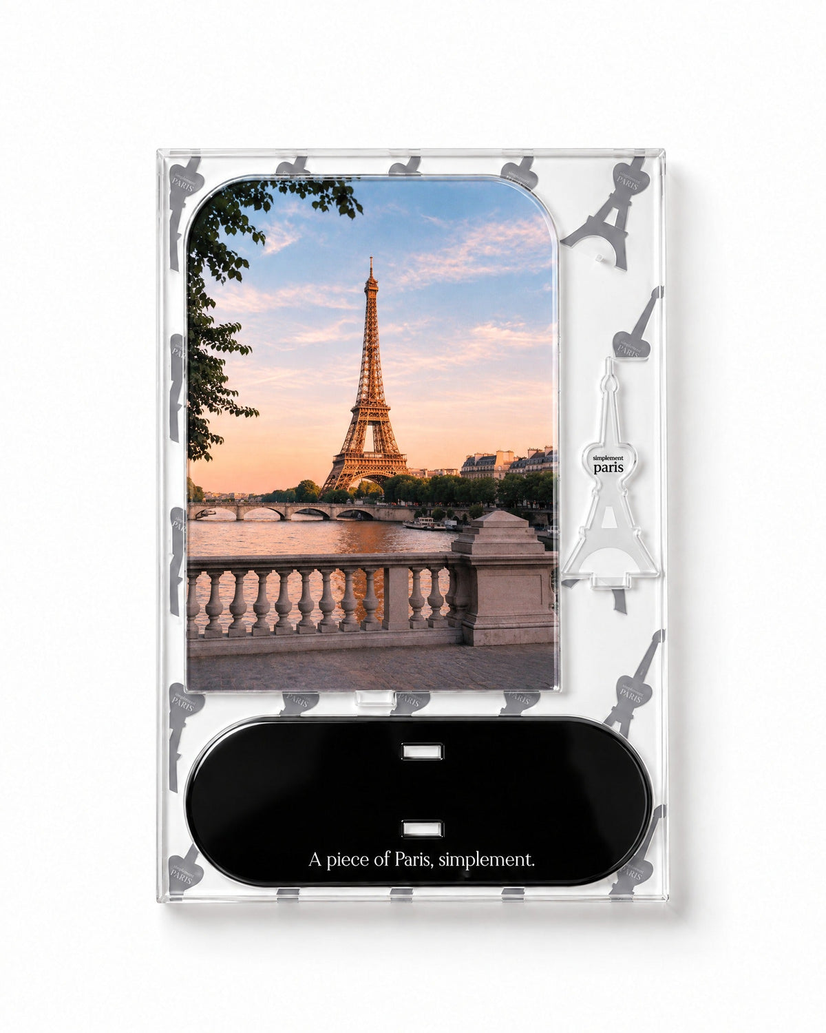 Flat-pack contents of Eiffel Sunset: acrylic panel, glossy black base and Eiffel Tower piece