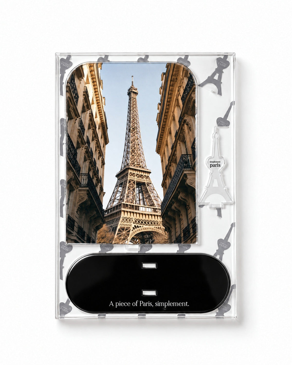 Flat-pack contents of Eiffel View: printed acrylic panel, glossy black base and Eiffel Tower piece