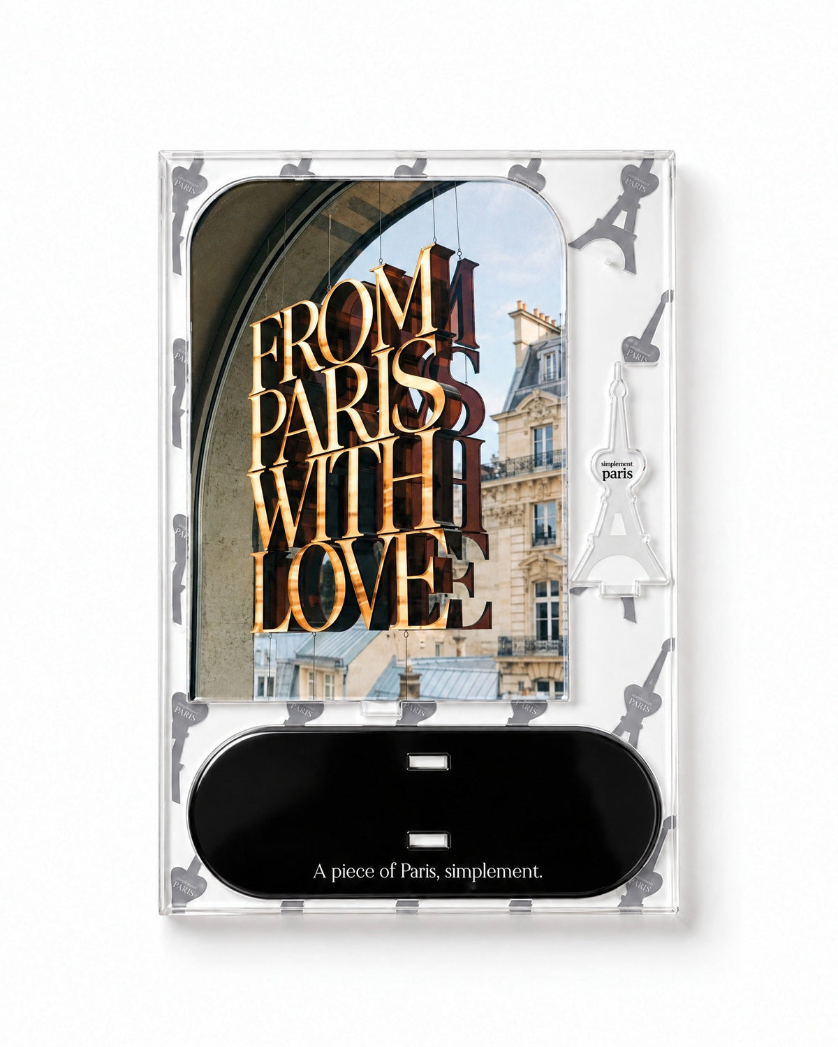 Flat-pack contents of From Paris with Love: acrylic panel, glossy black base and Eiffel Tower piece