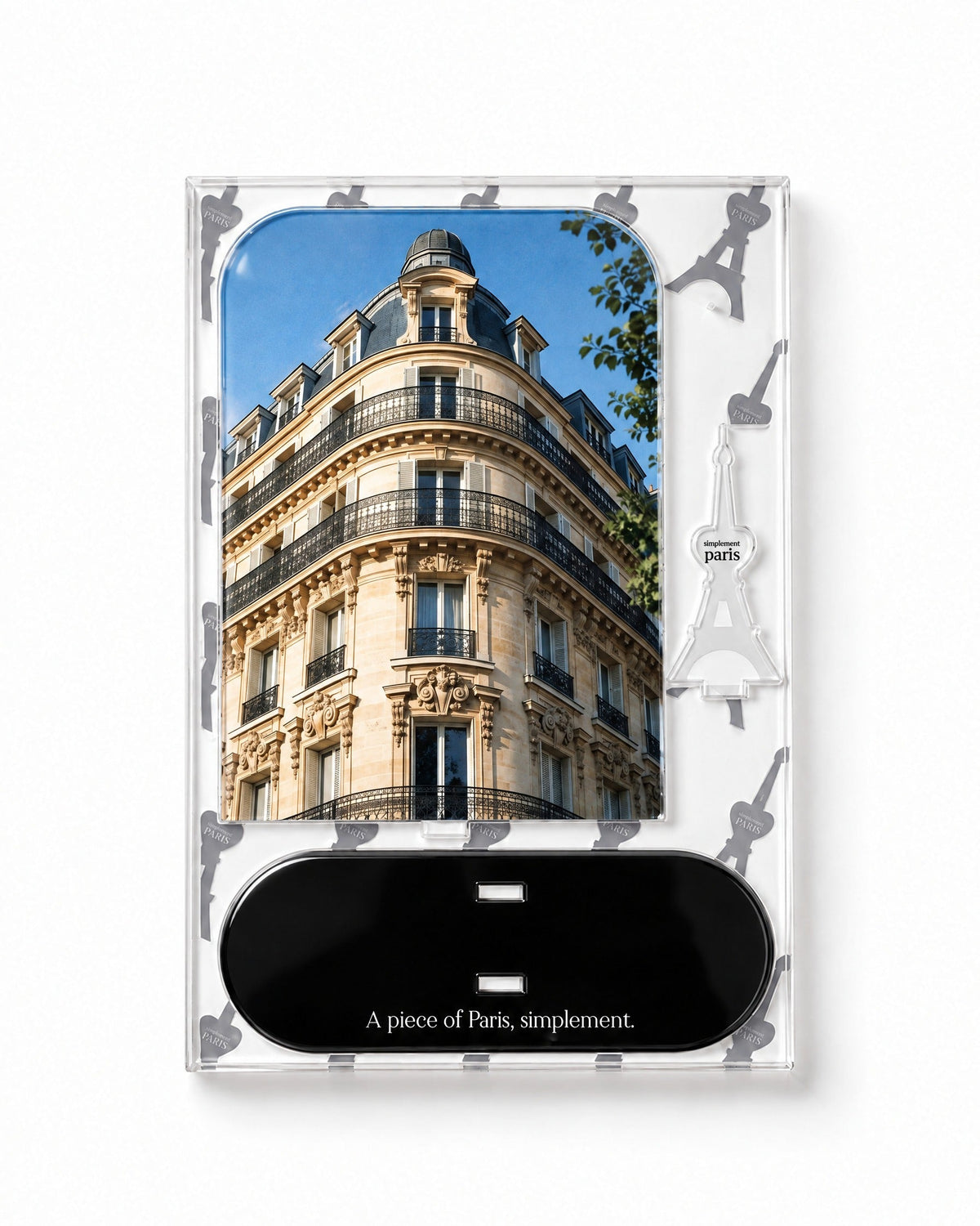 Flat-pack contents of Haussmann: printed acrylic panel, glossy black base and Eiffel Tower piece
