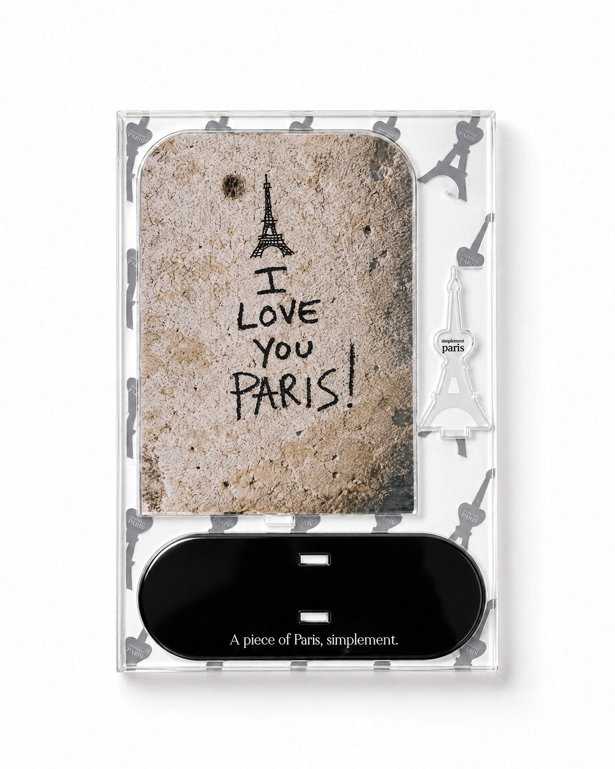 Flat-pack contents of I Love You Paris: printed acrylic panel, glossy black base and Eiffel Tower piece