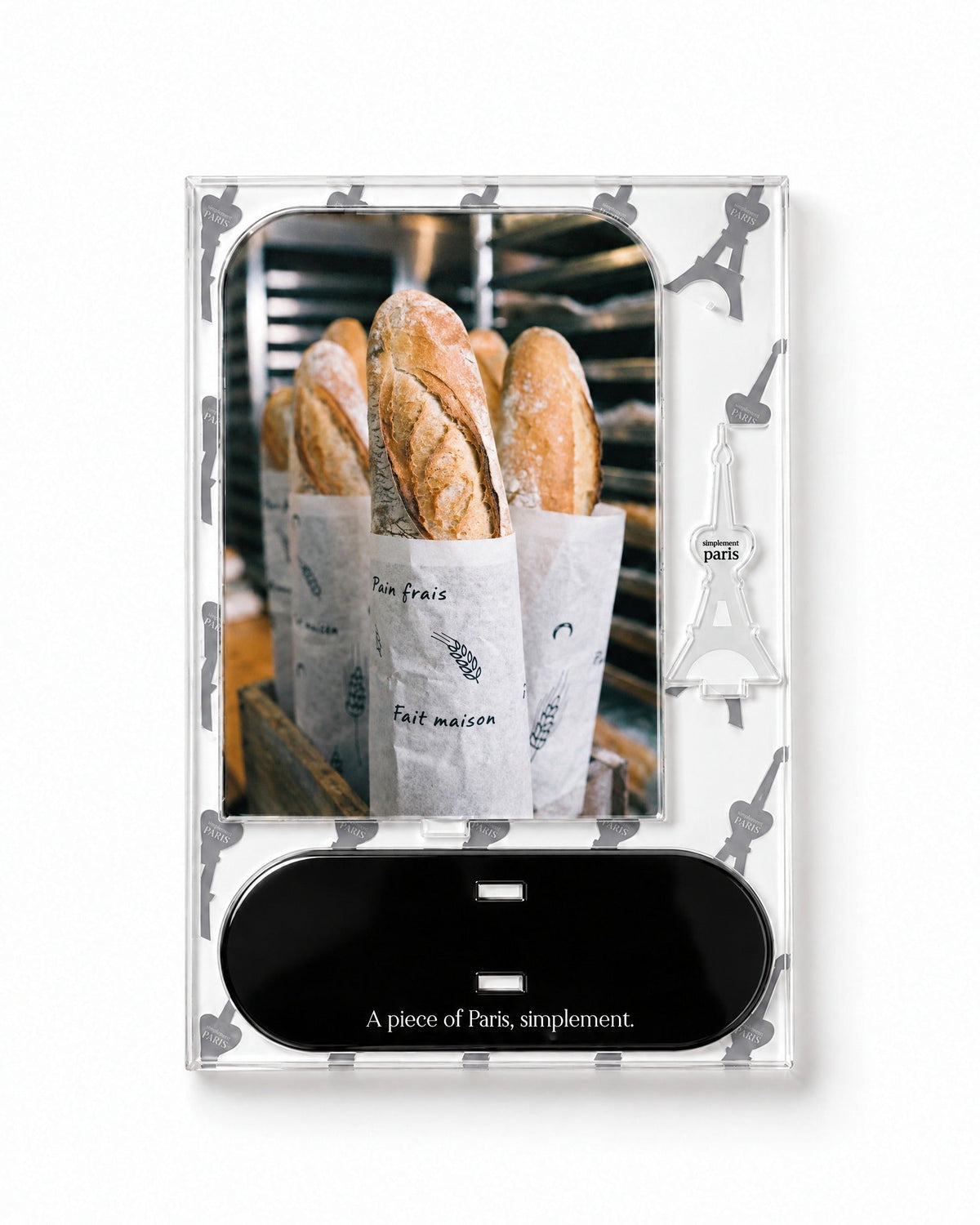 Flat-pack contents of La Baguette: acrylic panel, glossy black base and Eiffel Tower piece