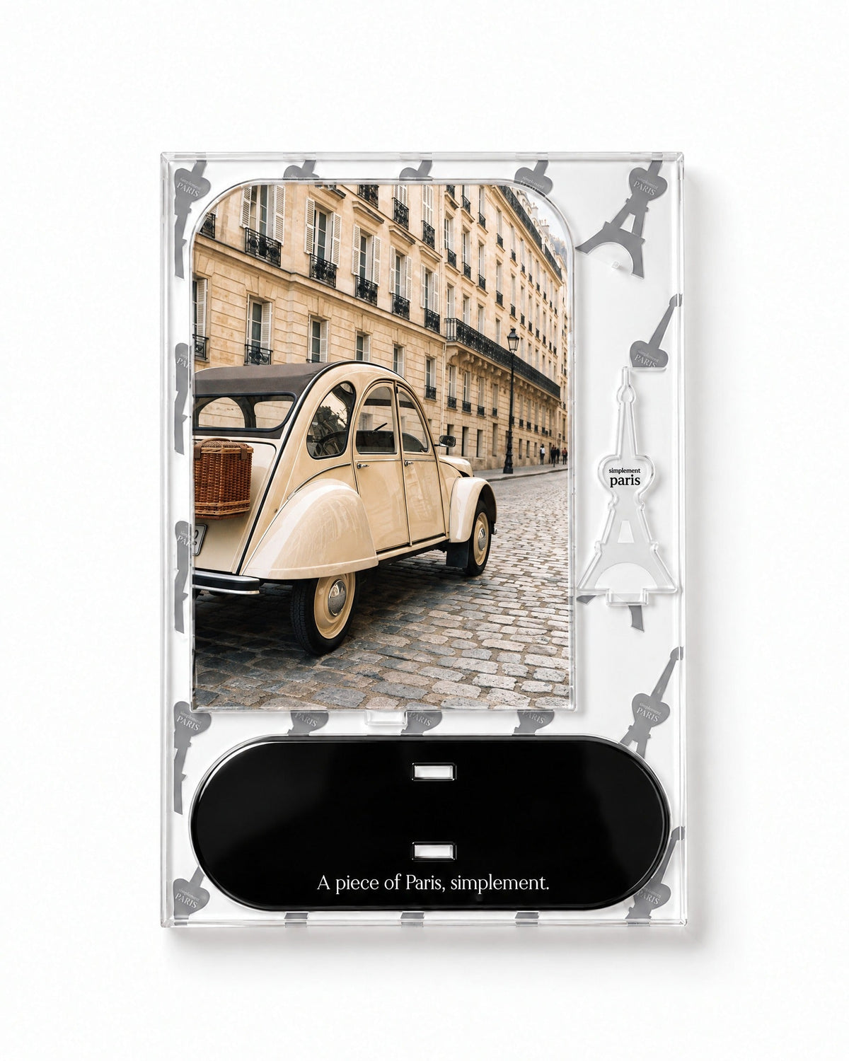 Flat-pack contents of La Deux Chevaux: acrylic panel, glossy black base and Eiffel Tower piece