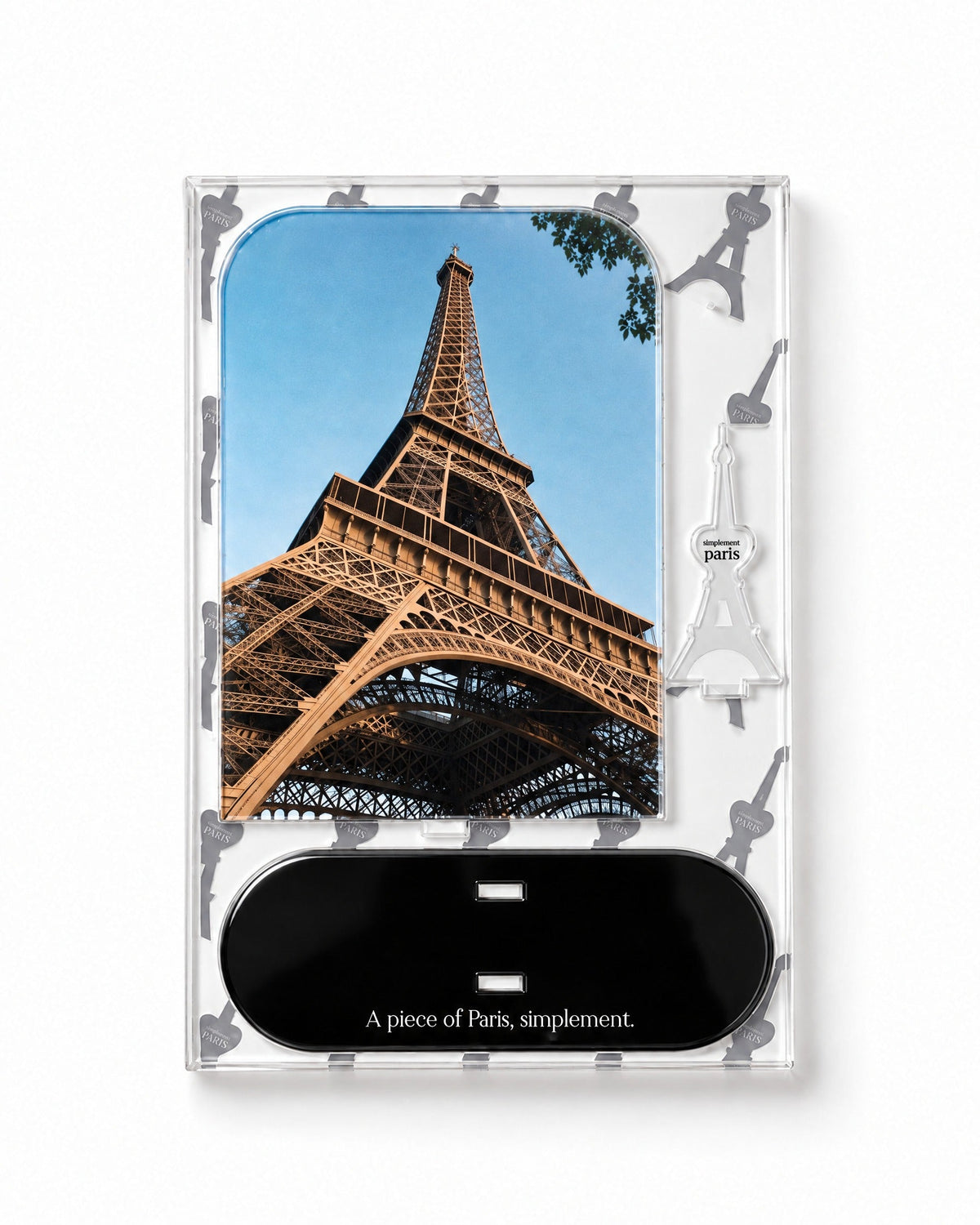 Flat-pack contents of La Tour Eiffel: printed acrylic panel, glossy black base and Eiffel Tower piece