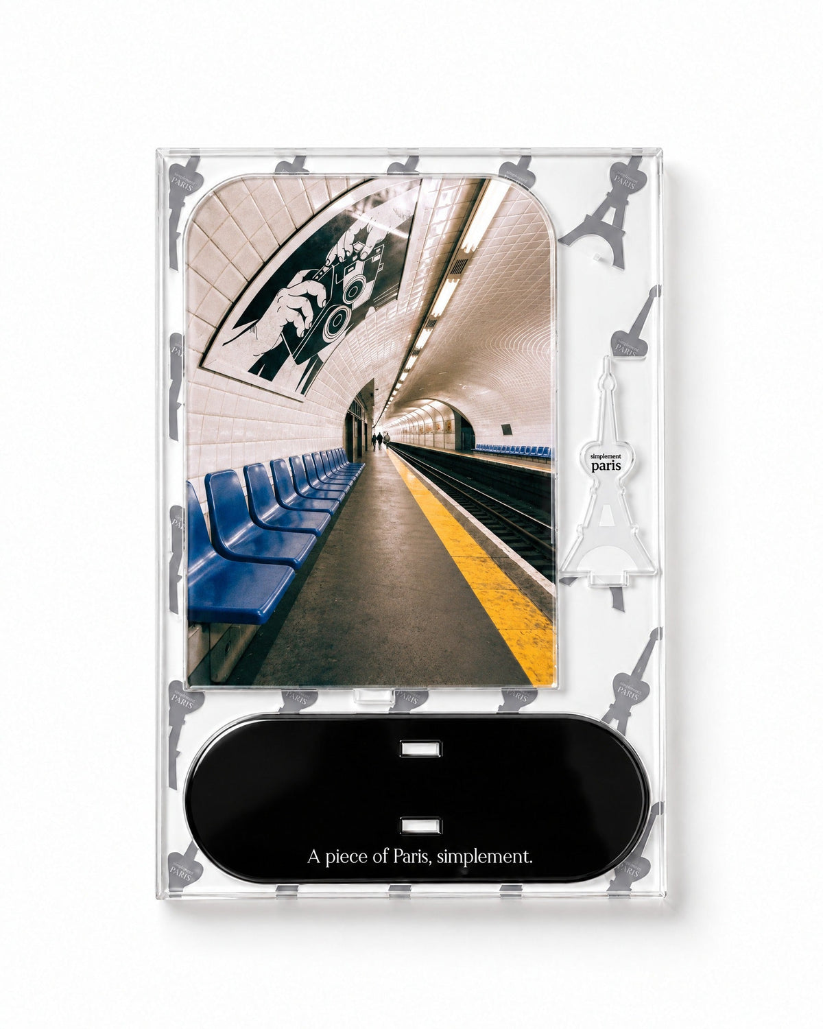 Flat-pack contents of Le Métro: acrylic panel, glossy black base and Eiffel Tower piece