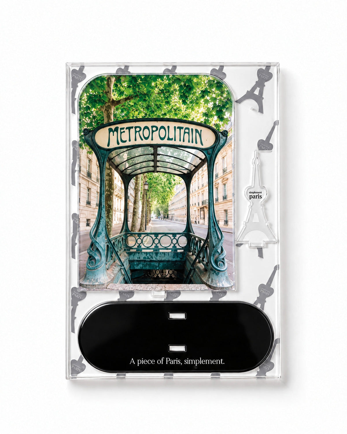Flat-pack contents of Métropolitain: acrylic panel, glossy black base and Eiffel Tower piece