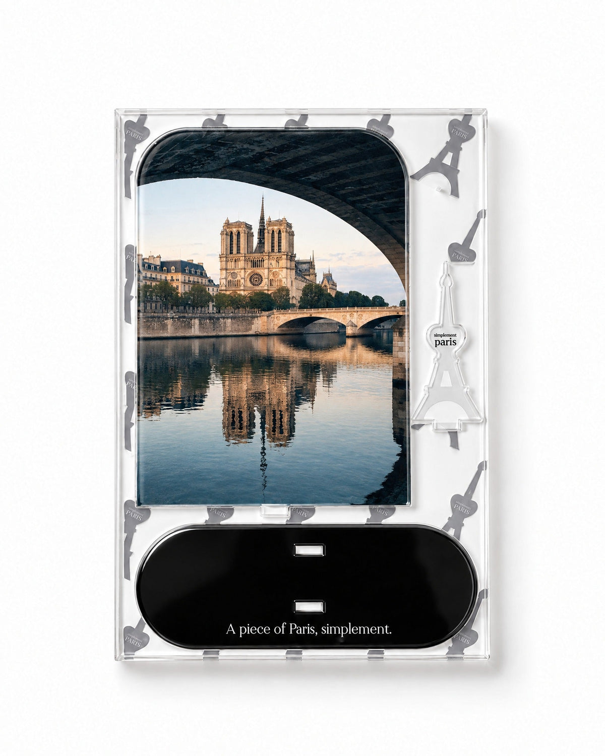 Flat-pack contents of Notre-Dame: acrylic panel, glossy black base and Eiffel Tower piece