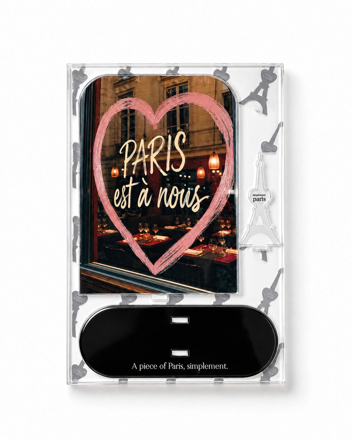 Flat-pack contents of Paris Est à Nous: printed acrylic panel, glossy black base and Eiffel Tower piece