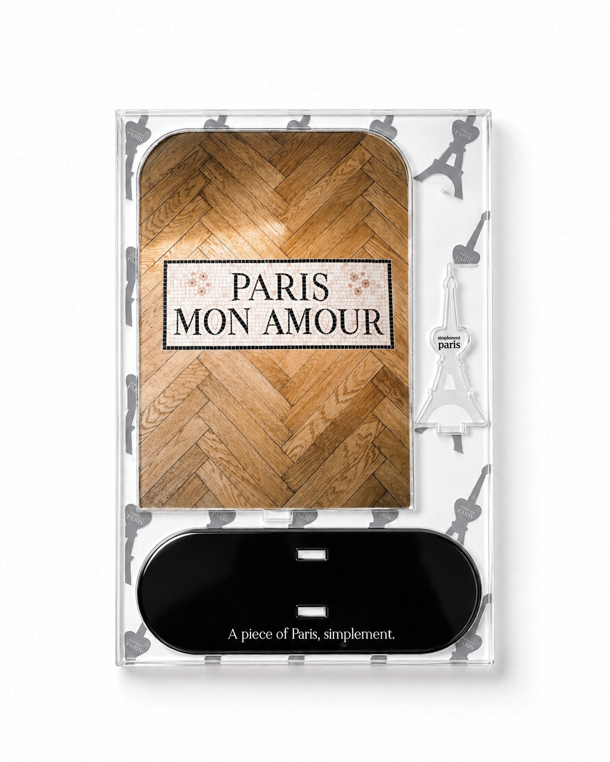 Flat-pack contents of Paris Mon Amour: acrylic panel, glossy black base and Eiffel Tower piece