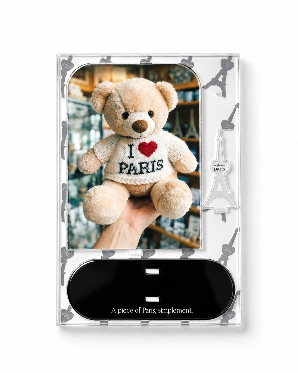 Flat-pack contents of Paris Teddy: printed acrylic panel, glossy black base and Eiffel Tower piece
