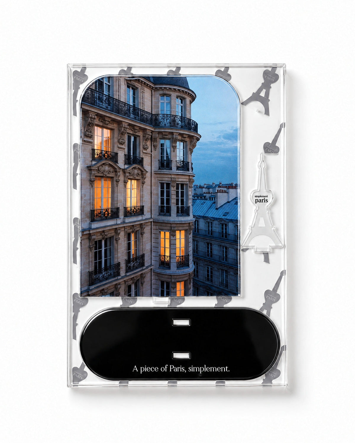 Flat-pack contents of Parisian Evening: printed acrylic panel, glossy black base and Eiffel Tower piece