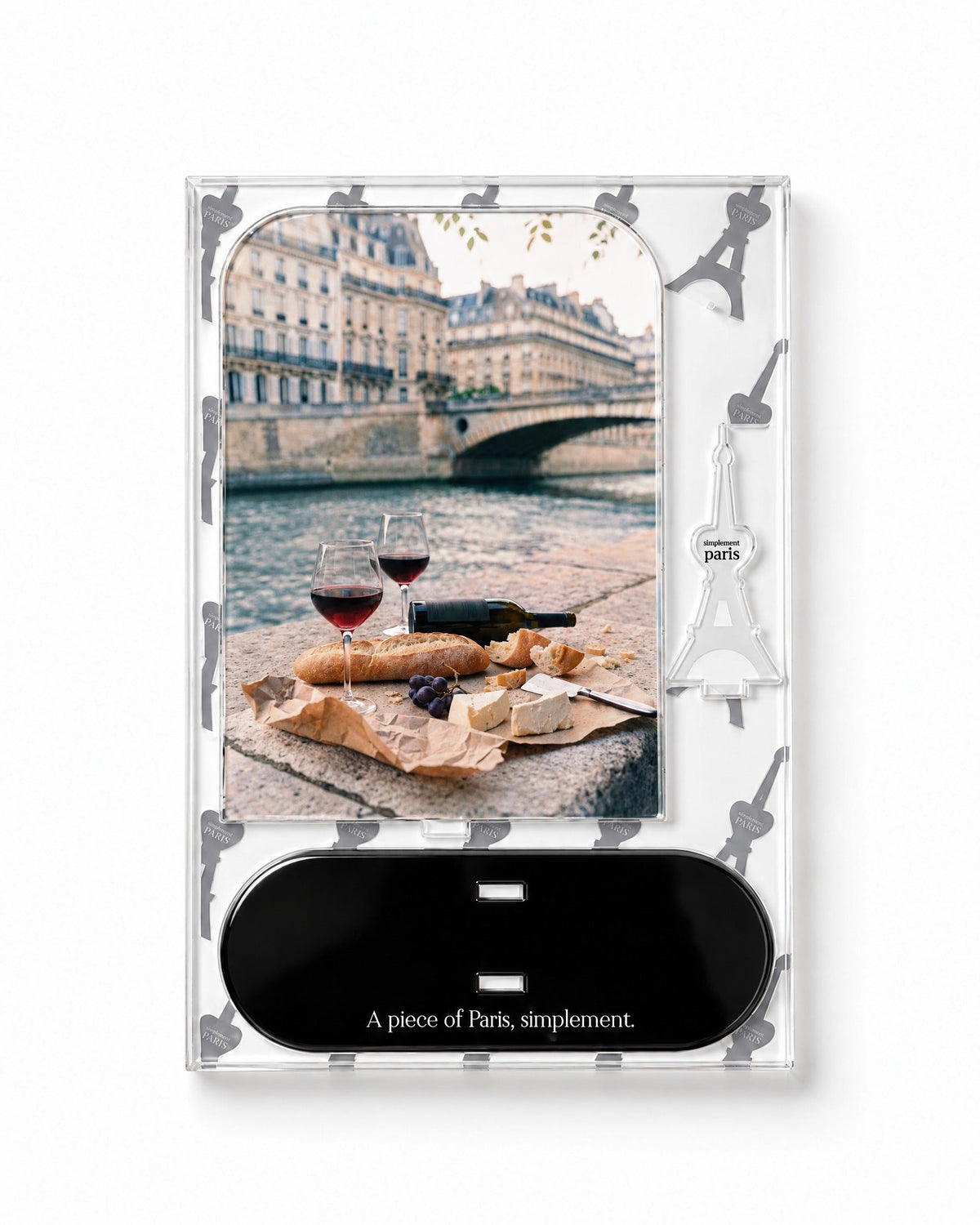 Flat-pack contents of Picnic on the Seine: printed acrylic panel, glossy black base and Eiffel Tower piece