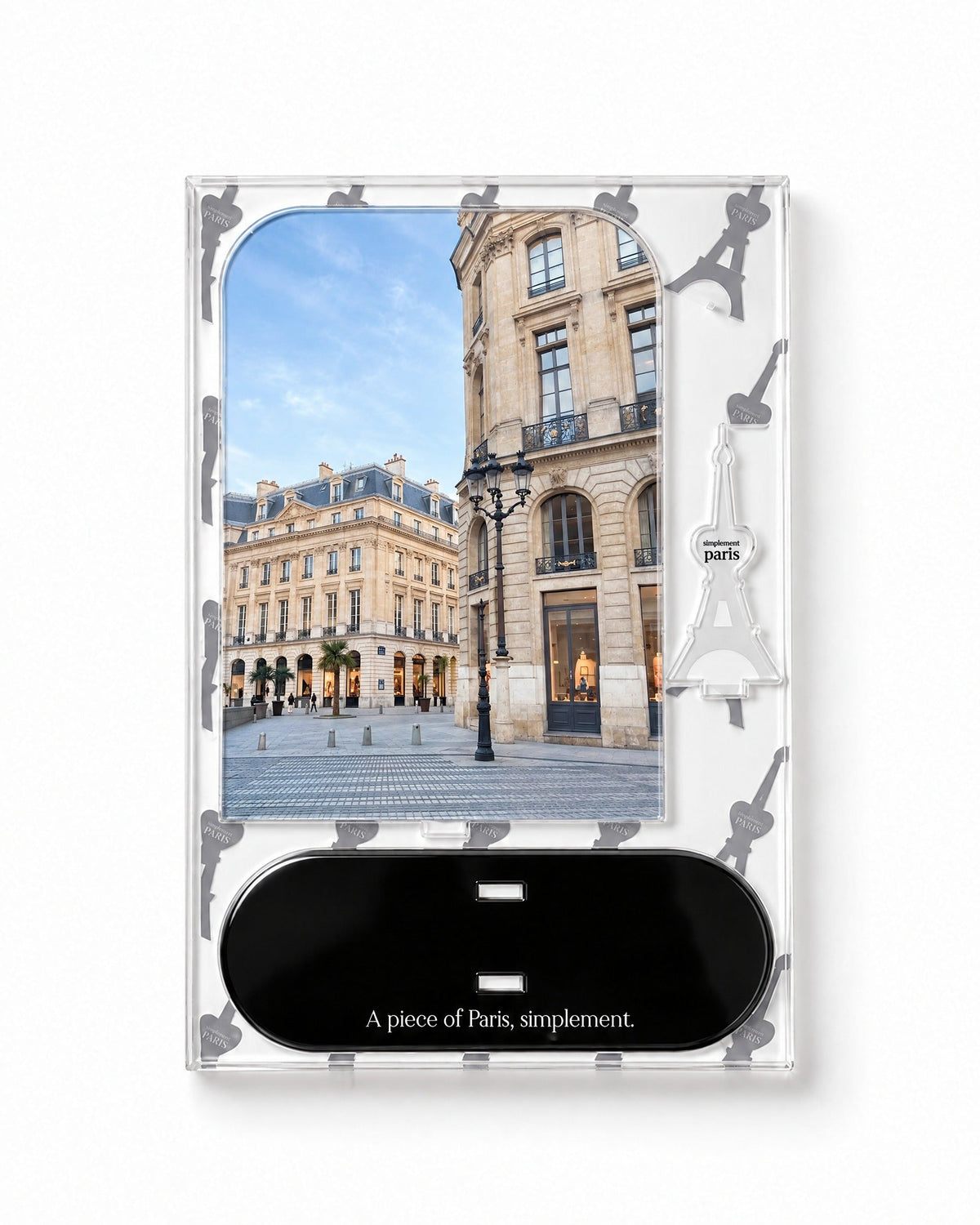 Flat-pack contents of Place Parisienne: printed acrylic panel, glossy black base and Eiffel Tower piece