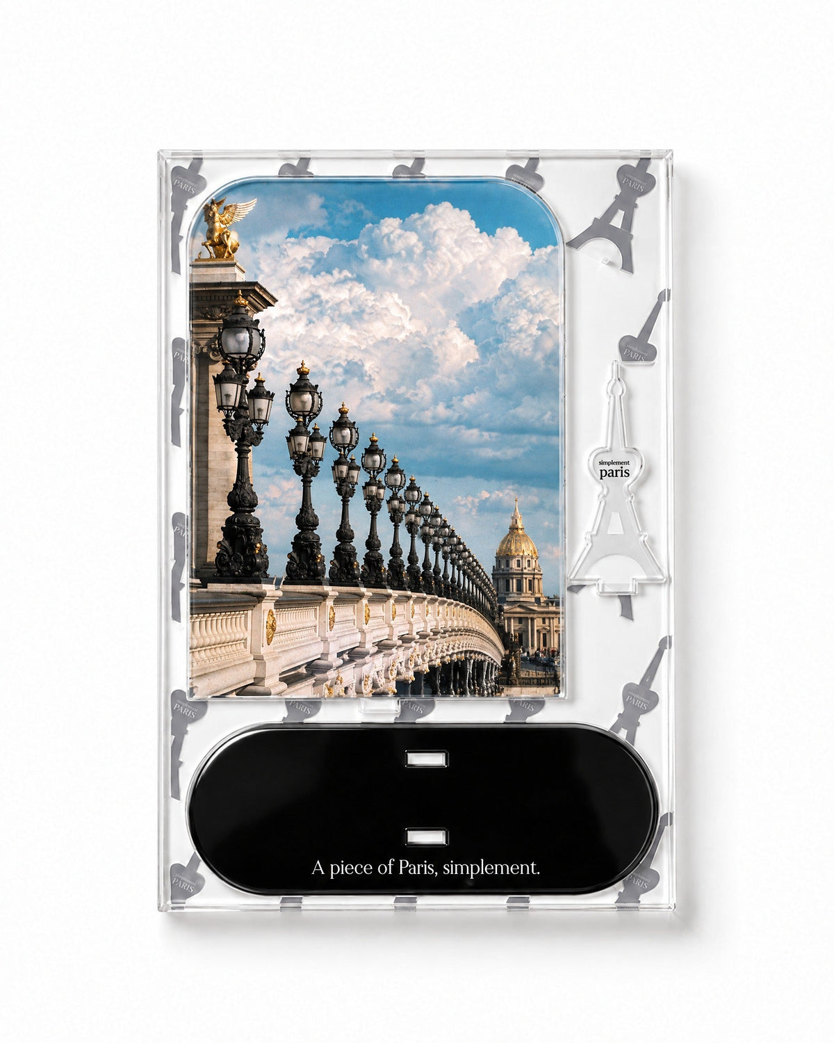 Flat-pack contents of Pont Alexandre III: acrylic panel, glossy black base and Eiffel Tower piece
