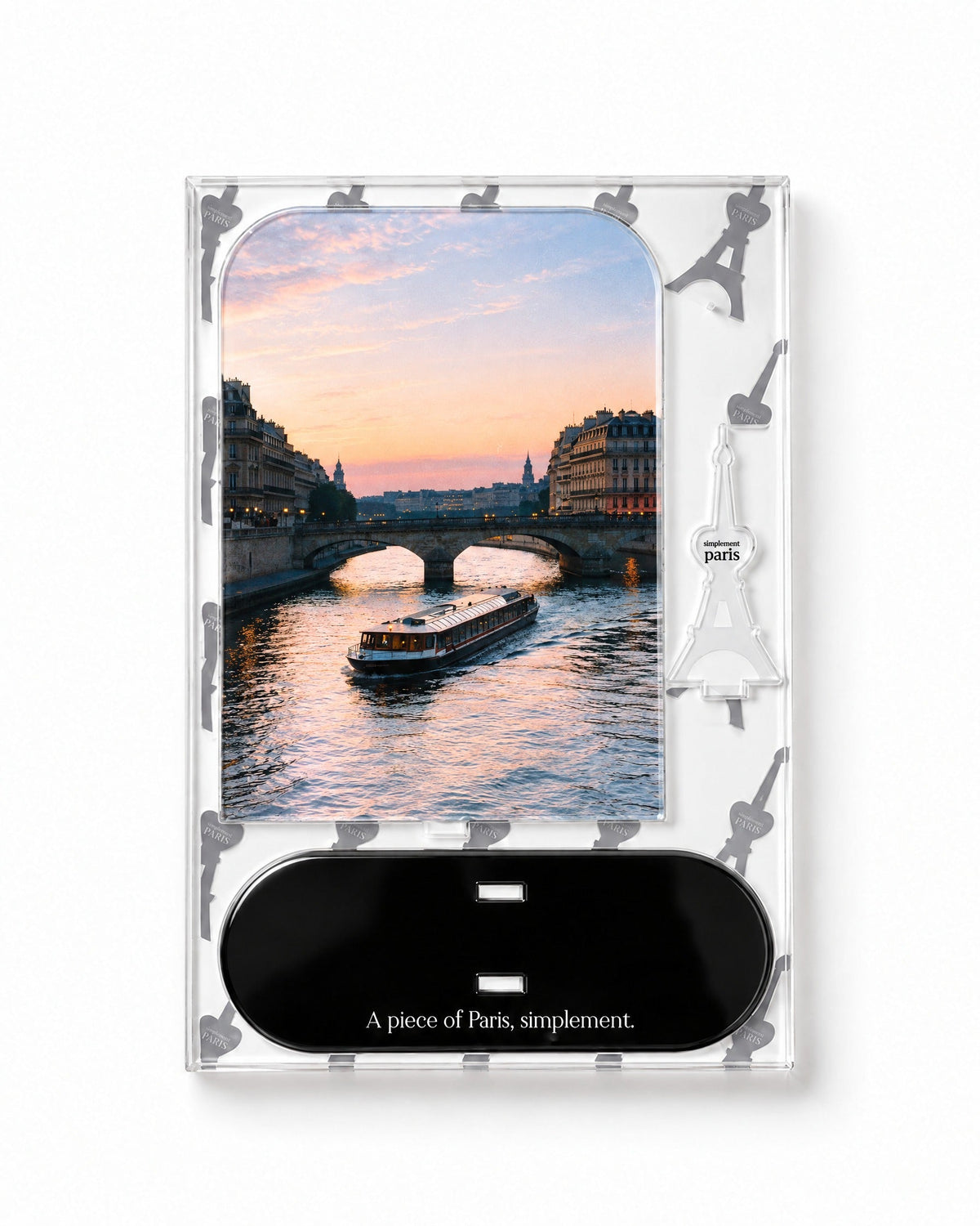 Flat-pack contents of Seine at Sunset: acrylic panel, glossy black base and Eiffel Tower piece