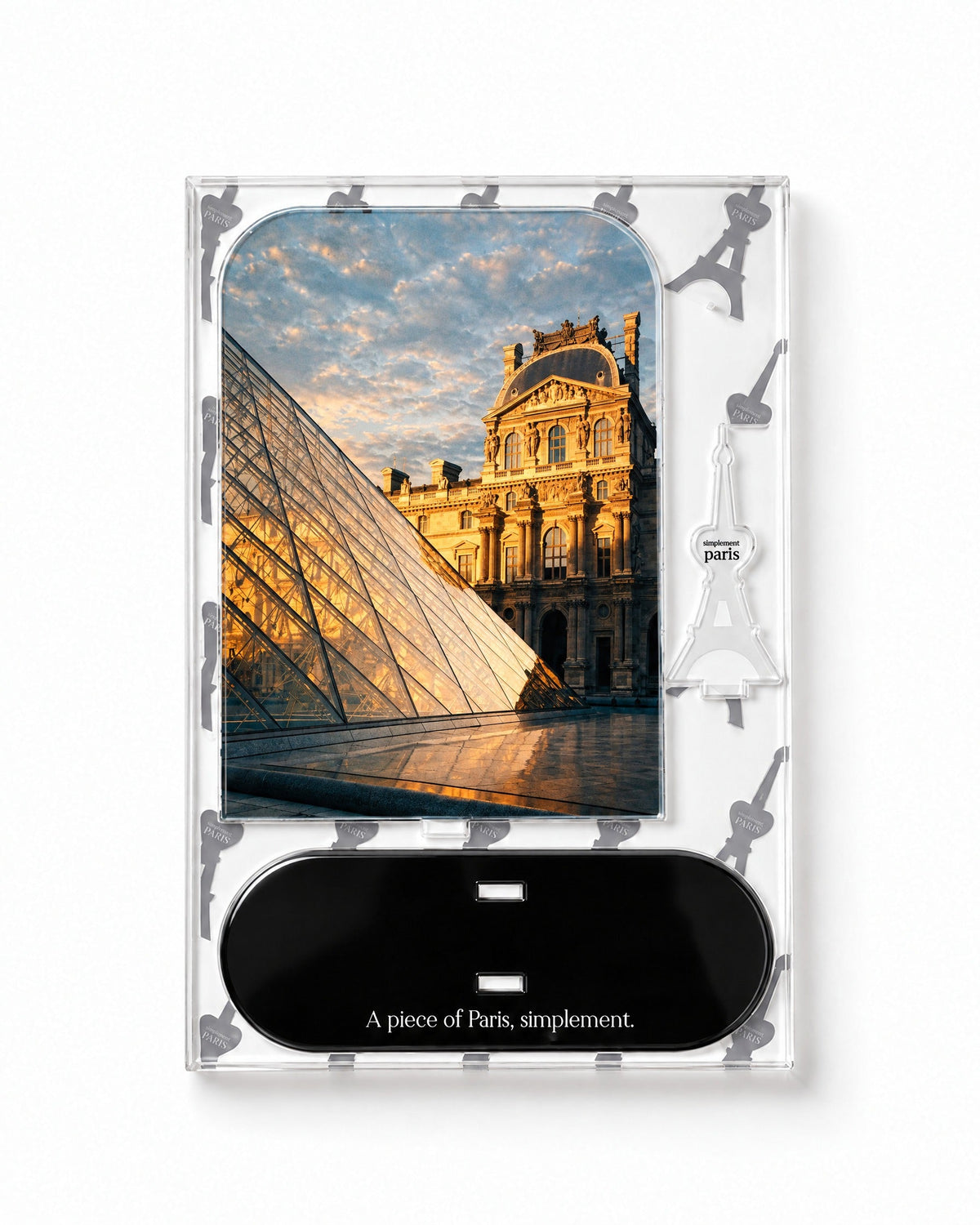 Flat-pack contents of The Louvre: printed acrylic panel, glossy black base and Eiffel Tower piece