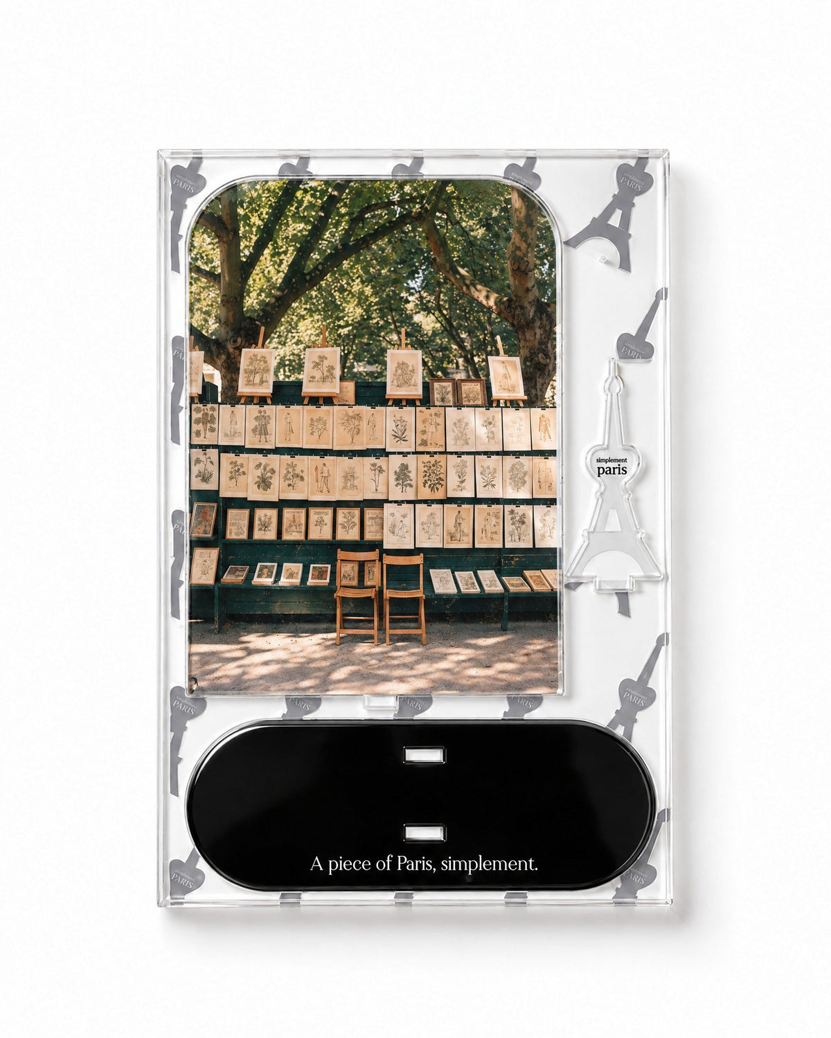 Flat-pack contents of The Print Sellers: printed acrylic panel, glossy black base and Eiffel Tower piece