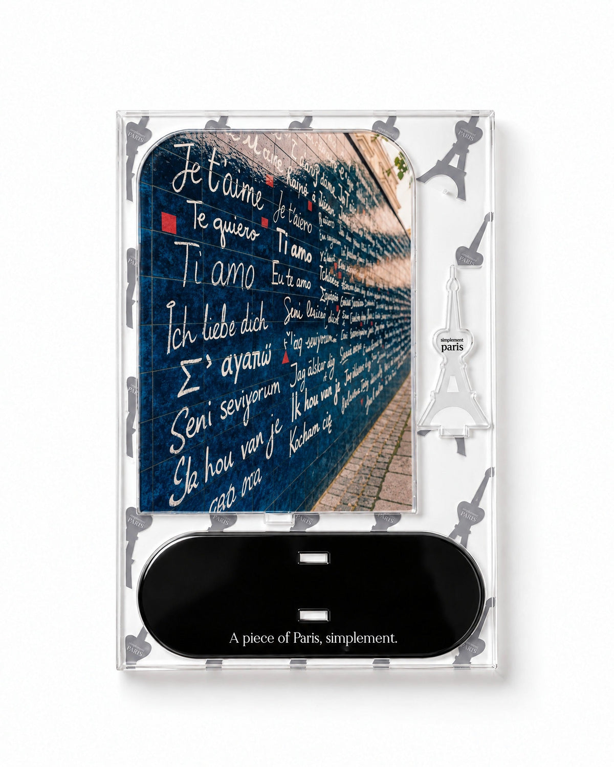 Flat-pack contents of Wall of Love: acrylic panel, glossy black base and Eiffel Tower piece